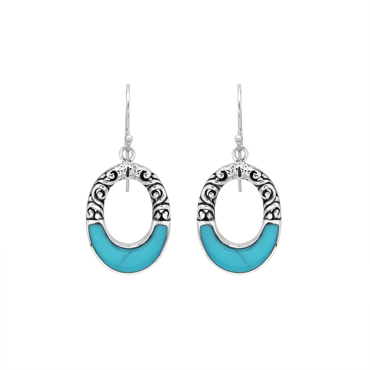 Sterling silver oval drop earrings featuring vibrant Turquoise Shell inlay, open center silhouette, sculpted scroll motifs, oxidized detailing, polished borders, and French ear wires.