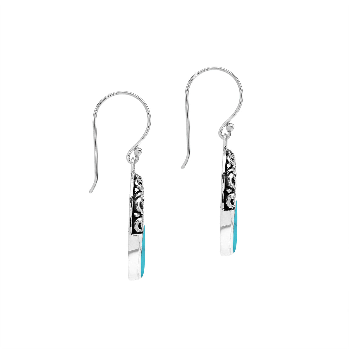 Sterling silver oval drop earrings featuring vibrant Turquoise Shell inlay, open center silhouette, sculpted scroll motifs, oxidized detailing, polished borders, and French ear wires.