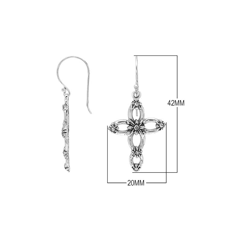 Sterling silver cross drop earrings featuring open oval sections, sculpted floral motifs, oxidized detailing, polished raised accents, and classic French ear wires.