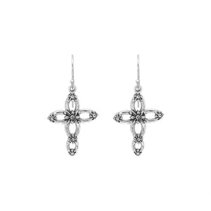 Sterling silver cross drop earrings featuring open oval sections, sculpted floral motifs, oxidized detailing, polished raised accents, and classic French ear wires.