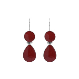 Sterling silver Red Coral dangle earrings featuring a round upper element and teardrop lower drop, polished bezel settings, articulated construction, and elongated ear wires.
