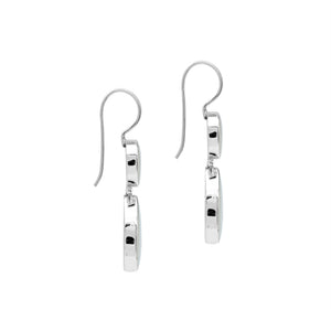 Sterling silver Mother Of Pearl dangle earrings featuring round and teardrop shell elements, polished bezel settings, articulated construction, and elegant elongated ear wires.