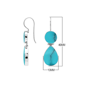 Sterling silver Turquoise Shell double drop earrings featuring circular upper settings, larger teardrop dangles, vibrant turquoise blue surfaces with dark veining, polished silver bezels, and curved fishhook earwires, shown in front and side views.