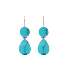 Sterling silver Turquoise Shell double drop earrings featuring circular upper settings, larger teardrop dangles, vibrant turquoise blue surfaces with dark veining, polished silver bezels, and curved fishhook earwires, shown in front and side views.