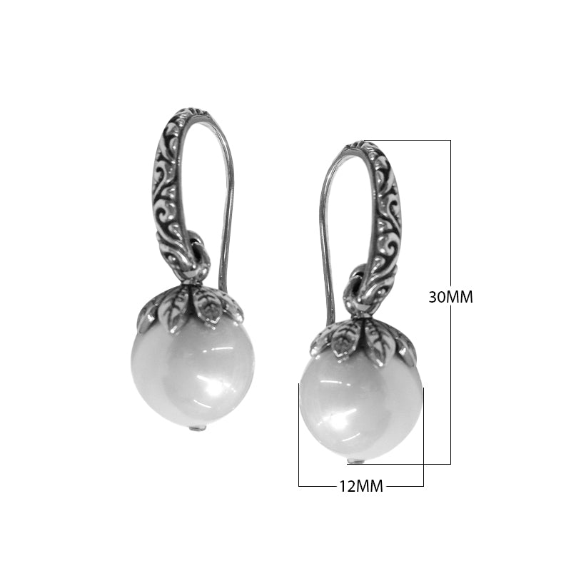 Wholesale sterling silver Shell Pearl earrings with leaf-cap design and earwire lock.
