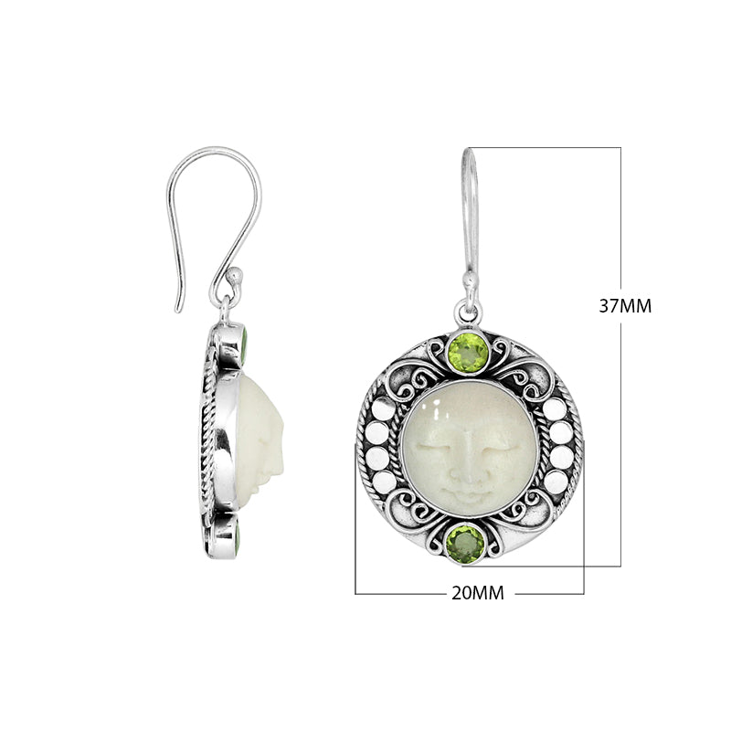 Wholesale sterling silver earrings with carved bone face and Peridot Quartz accents.