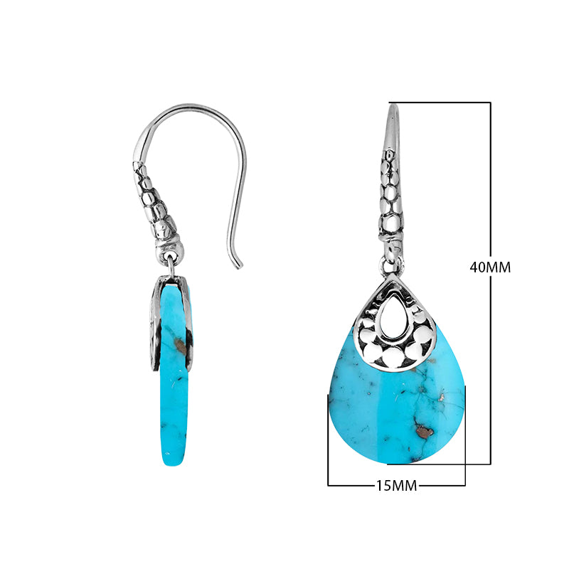 Wholesale-ready sterling silver earrings featuring Turquoise Shell drops set in a structured polished teardrop frame.