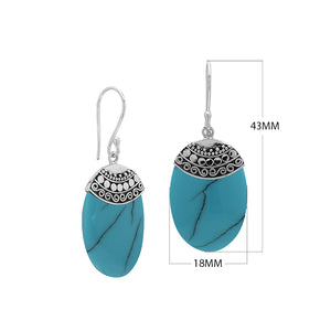 Wholesale sterling silver earrings with Turquoise Shell ovals and an ornate patterned silver cap.