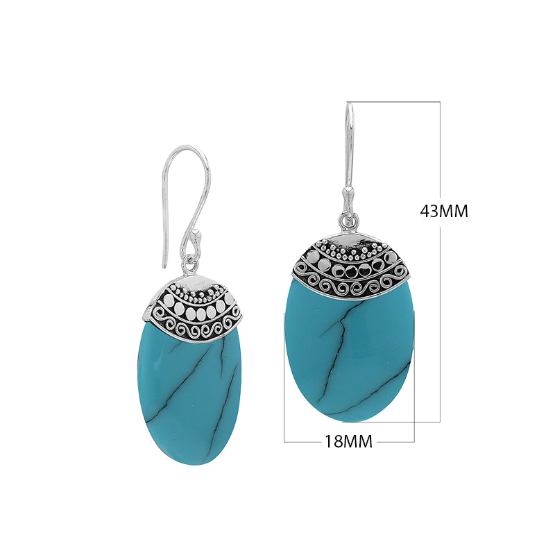 Wholesale sterling silver earrings with Turquoise Shell ovals and an ornate patterned silver cap.