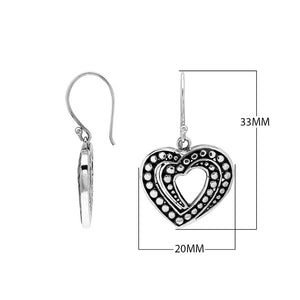 Sterling Silver Carved Heart-Shaped Dangle Earrings Featuring Dotted Balinese Detailing And Oxidized Finish