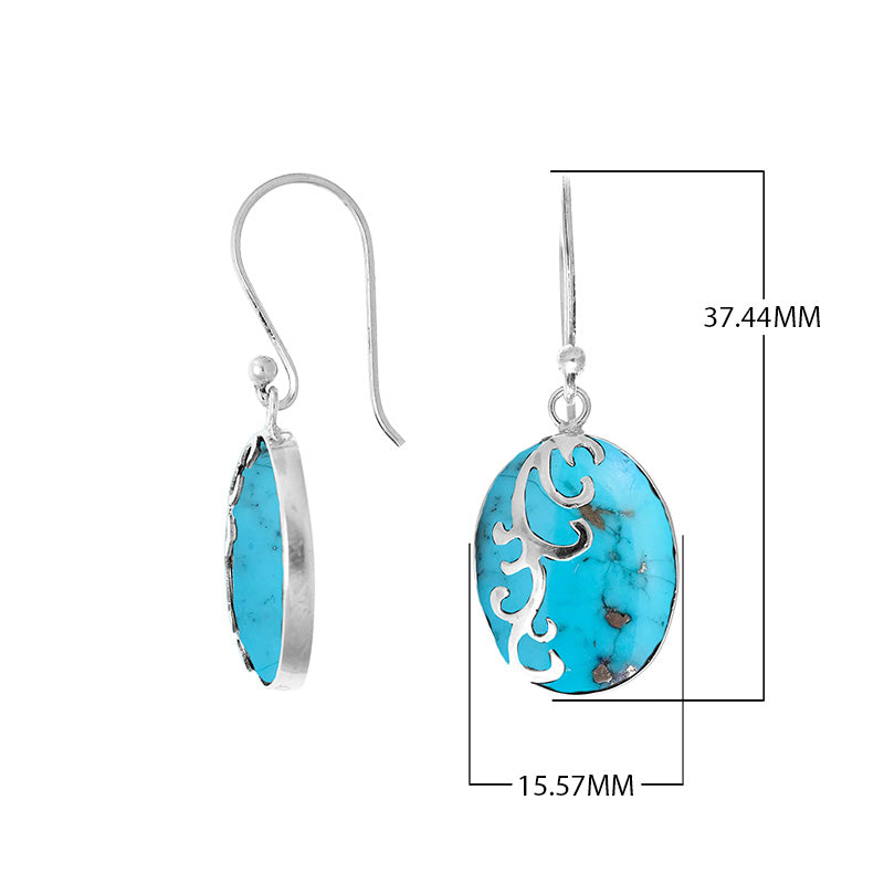 Wholesale sterling silver earrings featuring bright turquoise shell ovals with a polished wave-motif overlay, offering consistent artisan craftsmanship and elegant catalog-ready appeal for bulk jewelry sourcing.