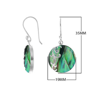 Wholesale sterling silver earrings featuring round abalone shell drops with polished wave-motif overlay, crafted to deliver consistent artisan quality and elegant catalog-ready presentation for bulk jewelry sourcing.