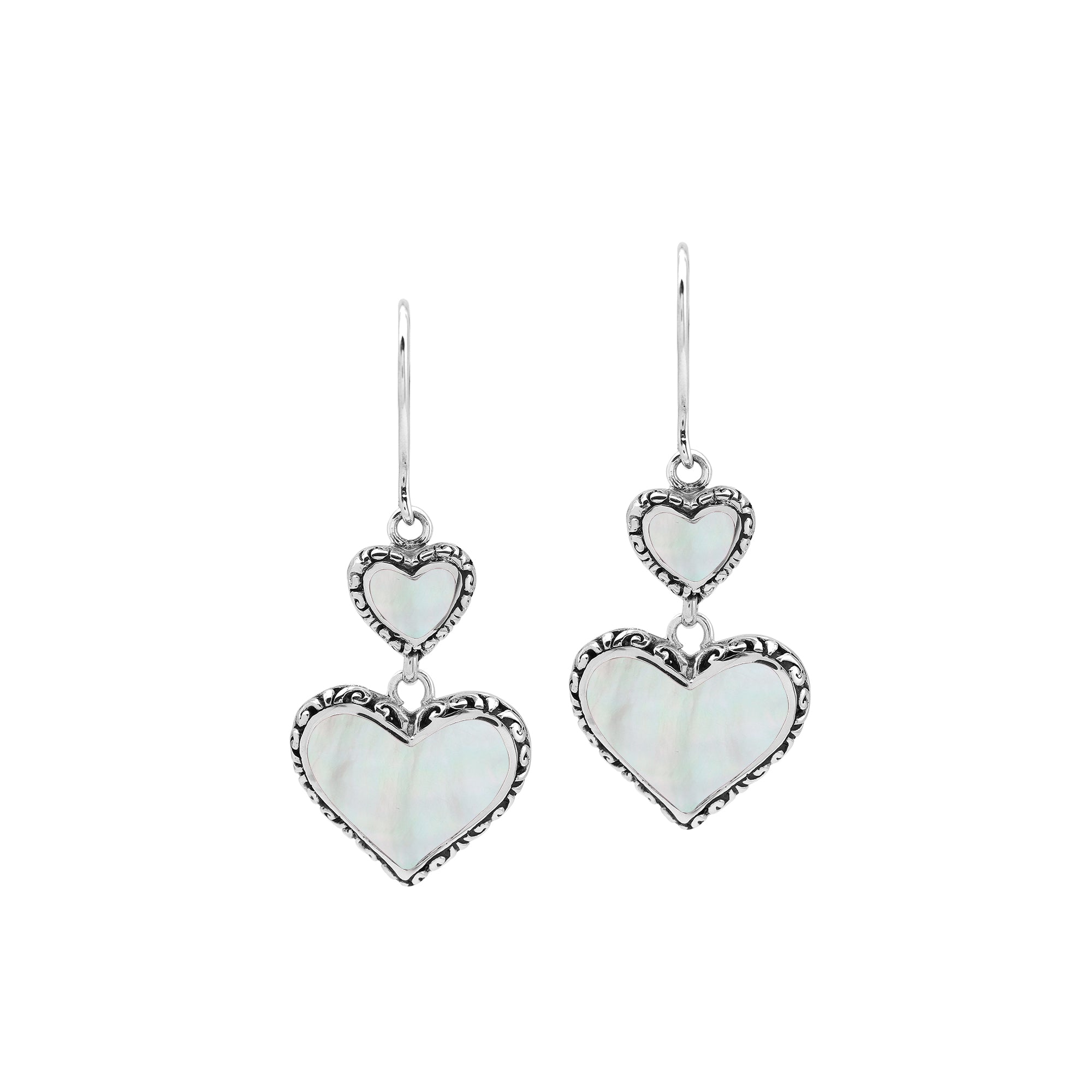 Wholesale sterling silver earrings featuring double mother of pearl heart drops with ornate decorative borders, crafted to deliver consistent artisan quality and elegant catalog-ready presentation for bulk jewelry buyers.