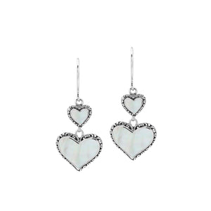 Wholesale sterling silver earrings featuring double mother of pearl heart drops with ornate decorative borders, crafted to deliver consistent artisan quality and elegant catalog-ready presentation for bulk jewelry buyers.