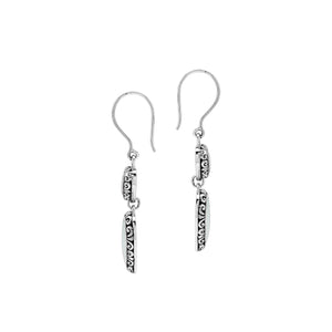 Wholesale sterling silver earrings featuring double mother of pearl heart drops with ornate decorative borders, crafted to deliver consistent artisan quality and elegant catalog-ready presentation for bulk jewelry buyers.