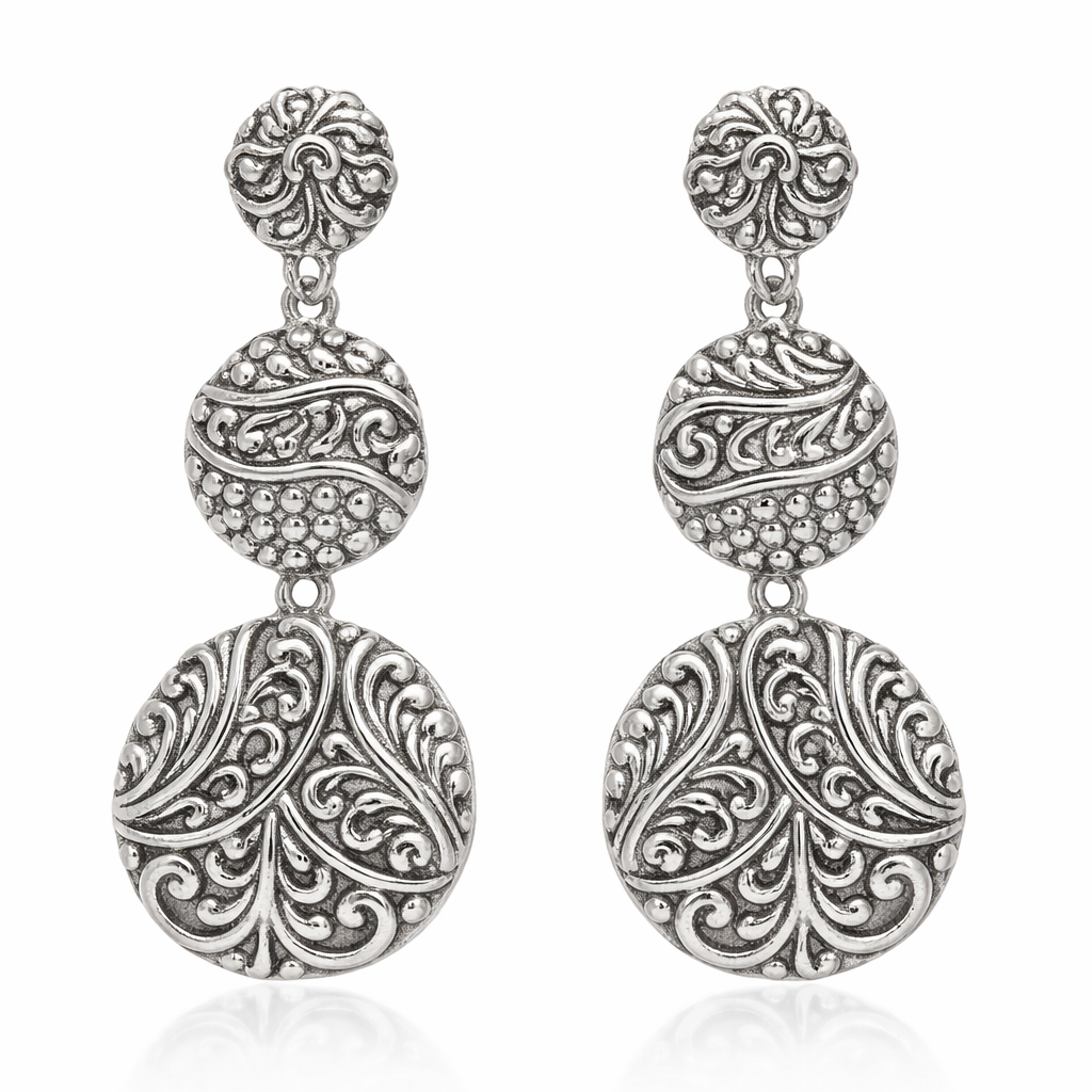 Sterling silver triple drop earrings with polished oval design and artisan detailing