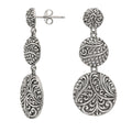 Sterling silver triple drop earrings with polished oval design and artisan detailing