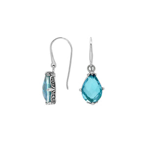 Wholesale Sterling Silver Blue Topaz Quartz Teardrop Earrings With Detailed Balinese-Style Metalwork.
