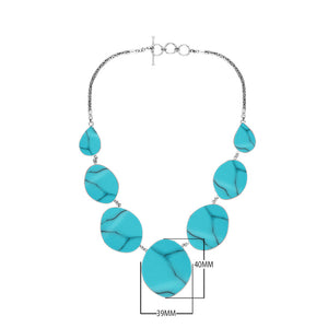 Sterling silver necklace with oval and teardrop turquoise shell links, polished artisan finish.