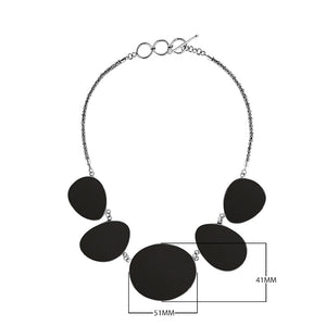 Sterling silver necklace with oval black shell links, polished artisan finish.