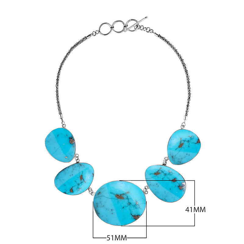 Sterling silver necklace with oval turquoise shell links in polished artisan finish.