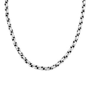 Sterling silver round box link chain necklace featuring substantial interlocking links, polished surfaces, oxidized recessed details, and a streamlined decorative push clasp.
