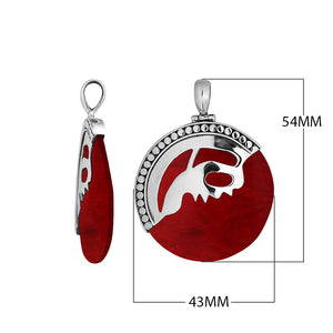 Sterling silver round pendant with vibrant red coral inlay and artistic silver overlay, handcrafted Bali jewelry available for wholesale purchase. 