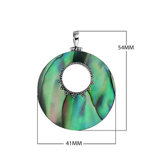 Wholesale sterling silver round Abalone shell pendant with iridescent blue-green inlay, center cut-out design, and oxidized dot detailing, handcrafted Bali artisan jewelry for bulk orders.