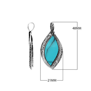 Wholesale sterling silver marquise pendant with genuine turquoise inlay and intricate Balinese carving, handcrafted in Bali.