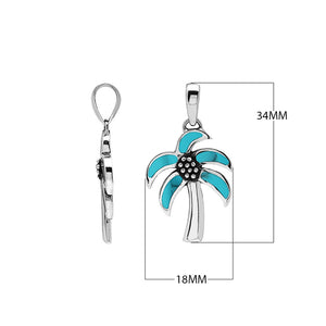 Sterling silver palm tree pendant with turquoise shell inlay, handmade in Bali for wholesale jewelry buyers.