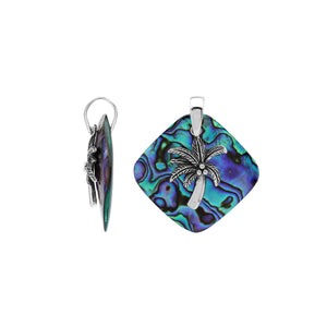 Sterling silver palm tree pendant on abalone shell diamond-shaped base, handmade in Bali for wholesale jewelry buyers.