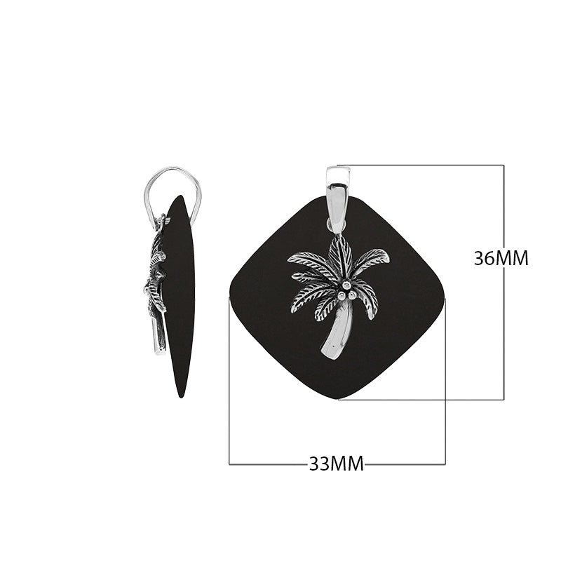 Sterling silver palm tree pendant on black shell diamond-shaped base, handmade in Bali for wholesale jewelry buyers.