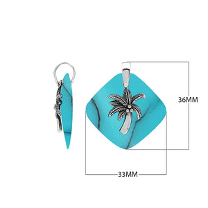Sterling silver palm tree pendant on turquoise shell diamond-shaped base, handmade in Bali for wholesale jewelry buyers.