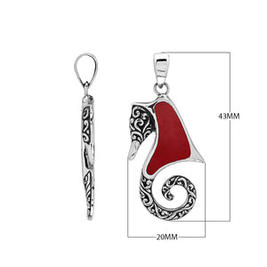 Sterling silver seahorse pendant with coral inlay and Balinese scroll detailing, handmade in Bali for wholesale buyers.