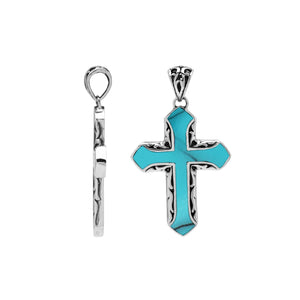 Sterling silver cross pendant with turquoise inlay and Balinese scroll detailing, wholesale artisan jewelry.