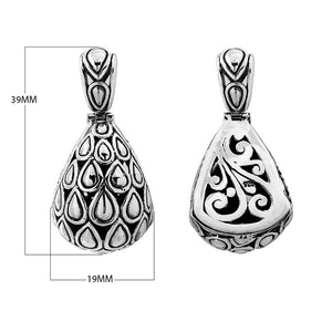 Sterling silver teardrop pendant with raised droplet motif and Bali swirl carvings, handcrafted in Bali.