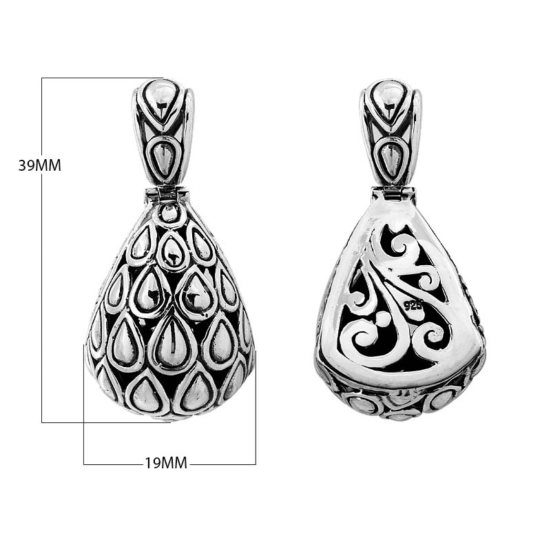 Sterling silver teardrop pendant with raised droplet motif and Bali swirl carvings, handcrafted in Bali.