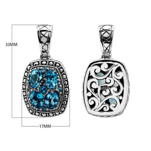 Sterling silver rectangular pendant with cluster of faceted Blue Topaz Quartz gemstones and Balinese swirl carvings, wholesale jewelry.
