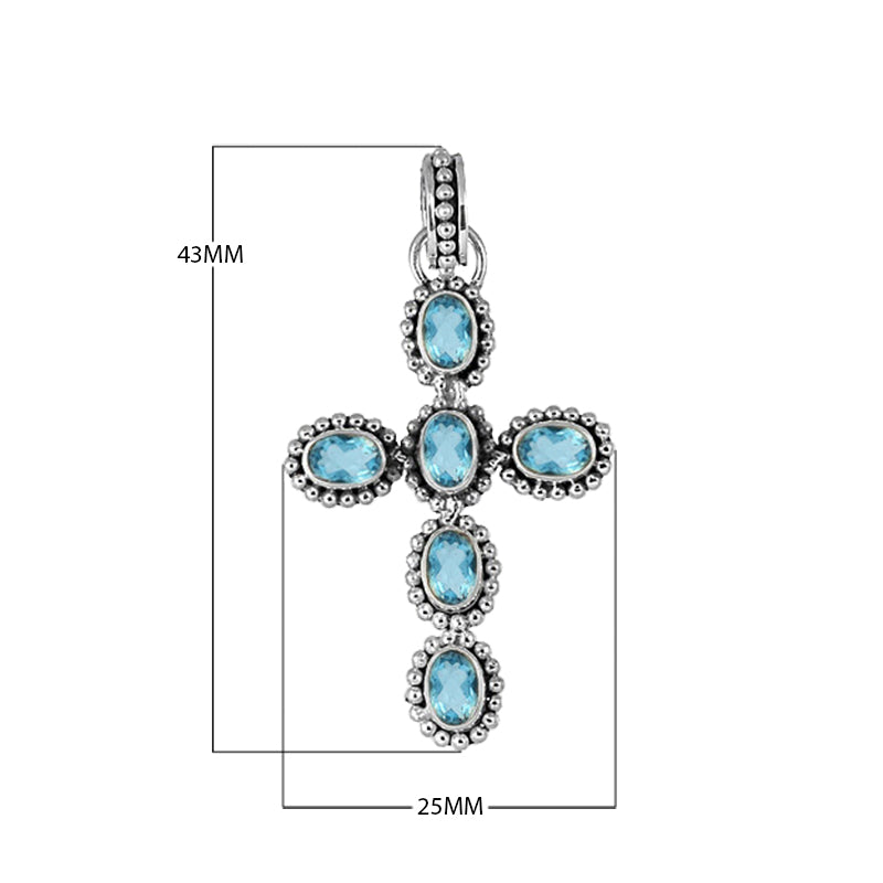 Sterling silver cross pendant with oval faceted blue topaz quartz and beaded detailing, handcrafted in Bali