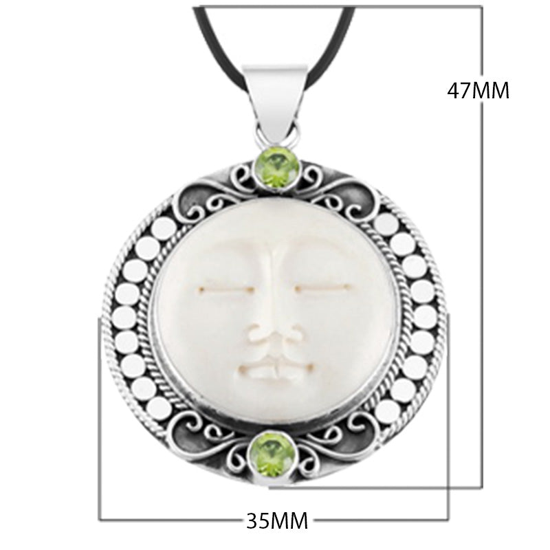 Wholesale Peridot Quartz and carved bone face sterling silver pendant handcrafted in Bali with Balinese artistry.