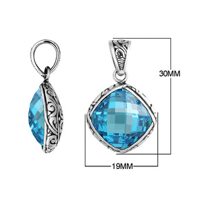 Sterling silver cushion pendant with blue topaz quartz and Balinese scroll pattern handcrafted in Bali.
