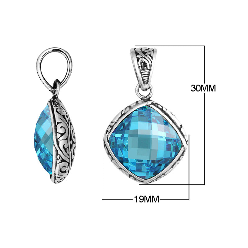 Sterling silver cushion pendant with blue topaz quartz and Balinese scroll pattern handcrafted in Bali.