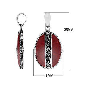 Handcrafted 925 Sterling Silver Red Coral oval pendant with detailed floral center design, mirror-polished finish, and traditional Balinese artistry for wholesale jewelry catalogs.66-CR Sterling Silver Pendant With Coral Jewelry Bali Designs Inc 
