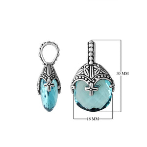Sterling silver heart pendant with blue topaz quartz and ornate Balinese handcrafted pattern