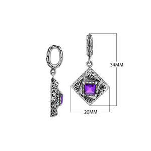 Diamond-shaped sterling silver pendant featuring square amethyst quartz centerpiece, filigree engraving, and smooth polished finish in classic Balinese design.