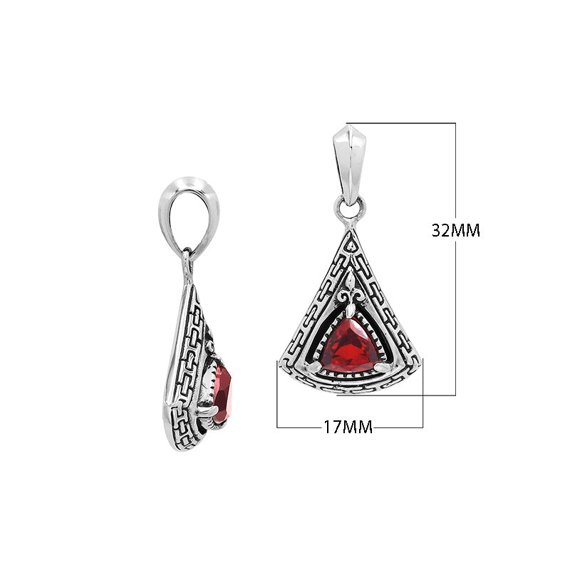 Triangular sterling silver pendant featuring red garnet quartz trillion-cut centerpiece, geometric Balinese engravings, and smooth high-gloss polish.