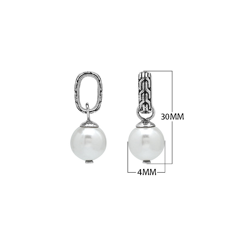 Sterling silver round drop pendant featuring a single Mabe Pearl and intricate Balinese silver detailing with mirror-polished finish.