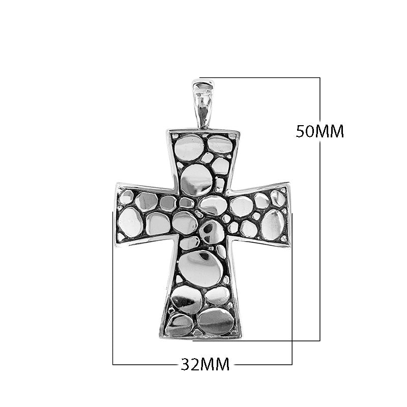 Sterling silver cross pendant featuring polished pebble texture and oxidized Balinese handcrafted detailing.