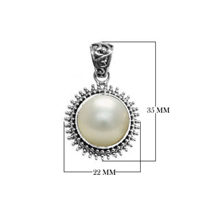 Sterling silver round pendant with Mabe Pearl and oxidized Balinese beaded handcrafted frame.