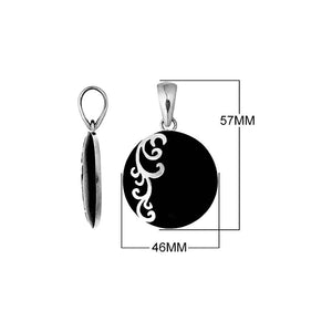 Sterling silver round Black Shell pendant featuring a smooth glossy black circular surface, decorative silver floral scrollwork along one side, and a polished tapered silver bail, displayed in front and side views.